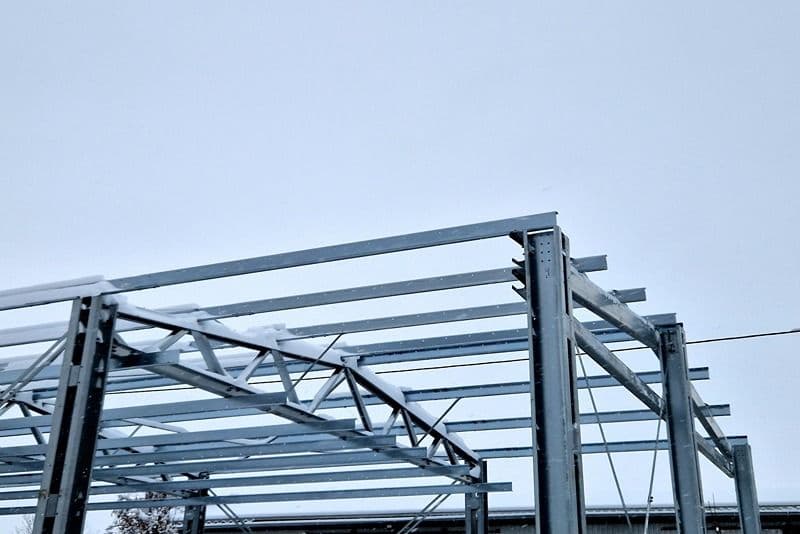 Steel column reinforcement techniques for seismic resistance